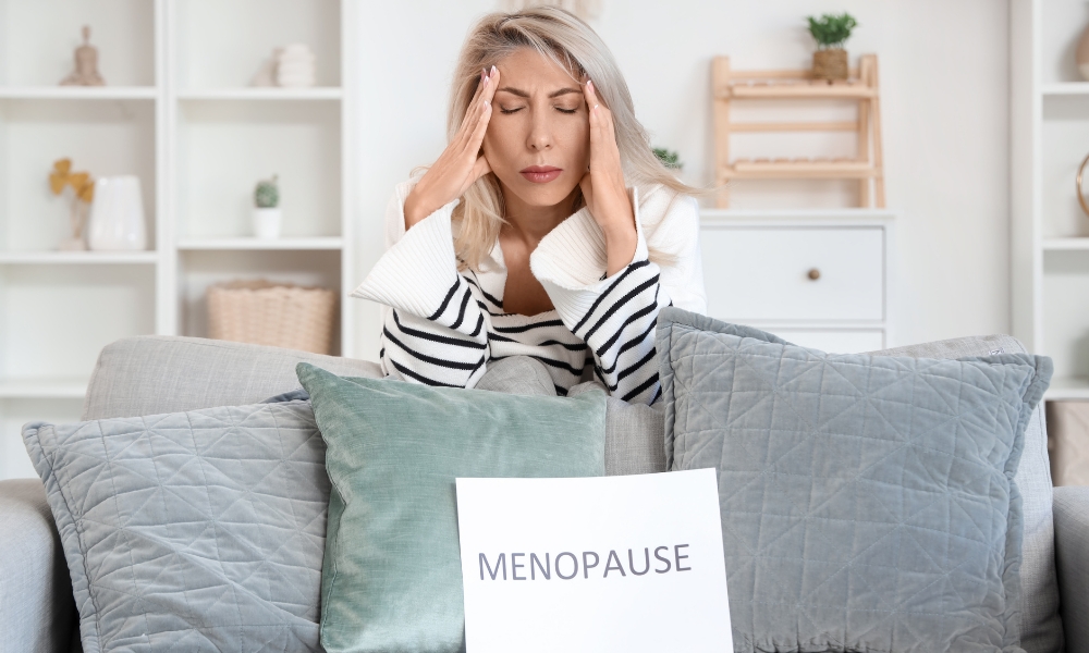 Female gynecologist discussing early menopause symptoms and hormone replacement therapy with a patient in Katy TX