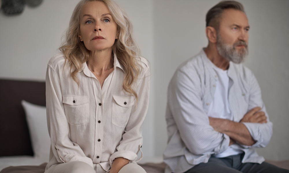 Woman experiencing pain or discomfort during sexual activity related to pelvic health or menopause