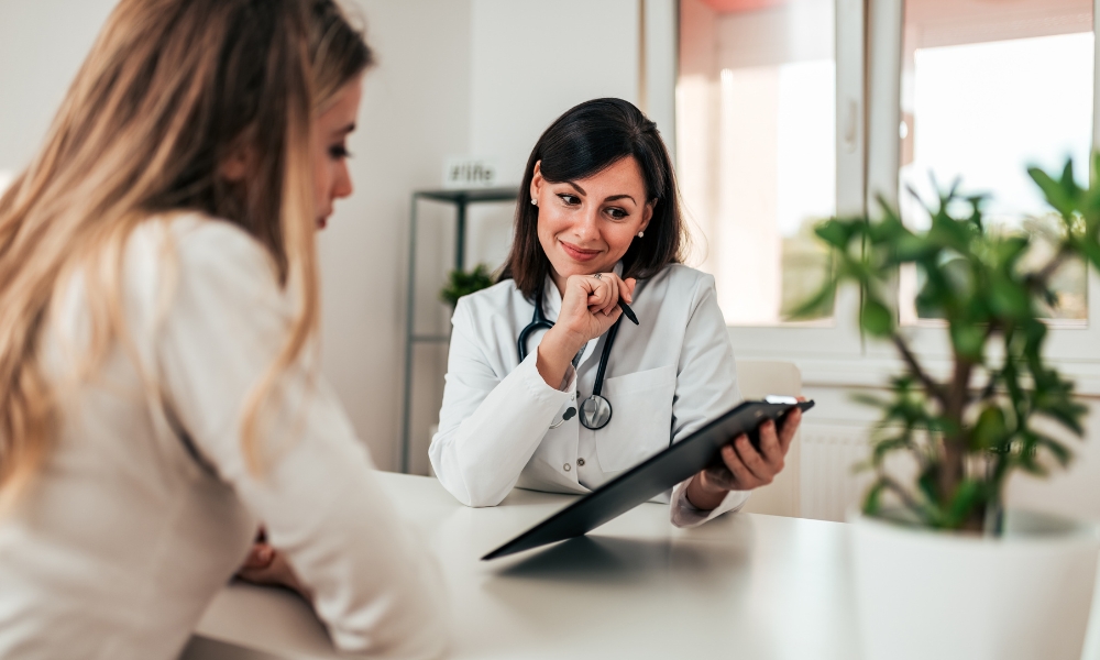 Women's health specialist discussing menopause insomnia treatment and hormone therapy with a patient in Katy TX