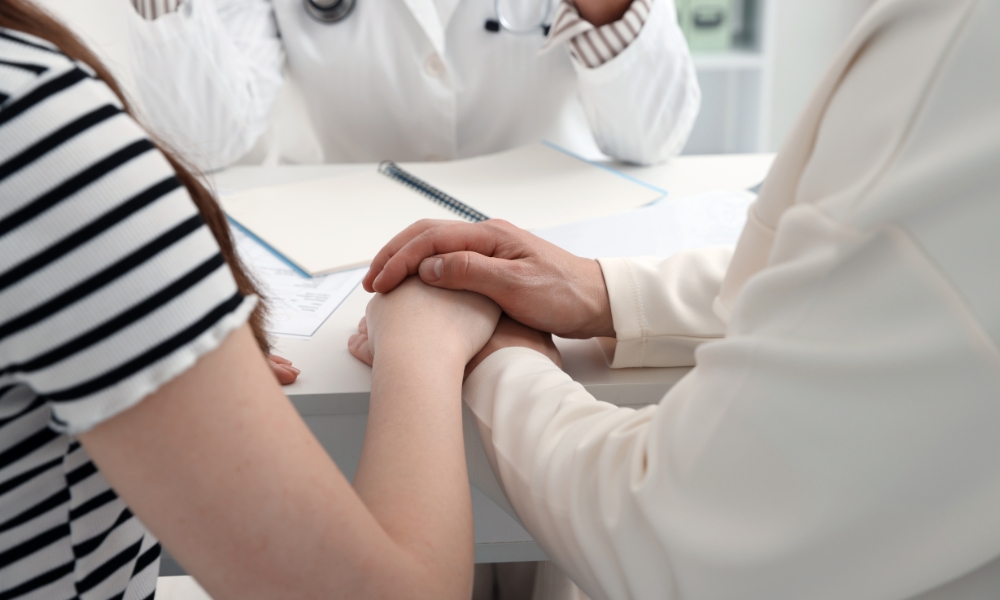 Women's health specialist explaining treatment options for painful intercourse and pelvic floor conditions