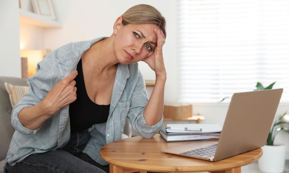 Doctor consulting a woman about hormone replacement therapy for frequent hot flashes in Katy TX